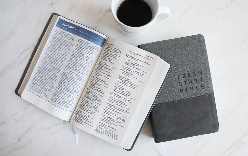 The Fresh Start Bible with a cup of coffee.